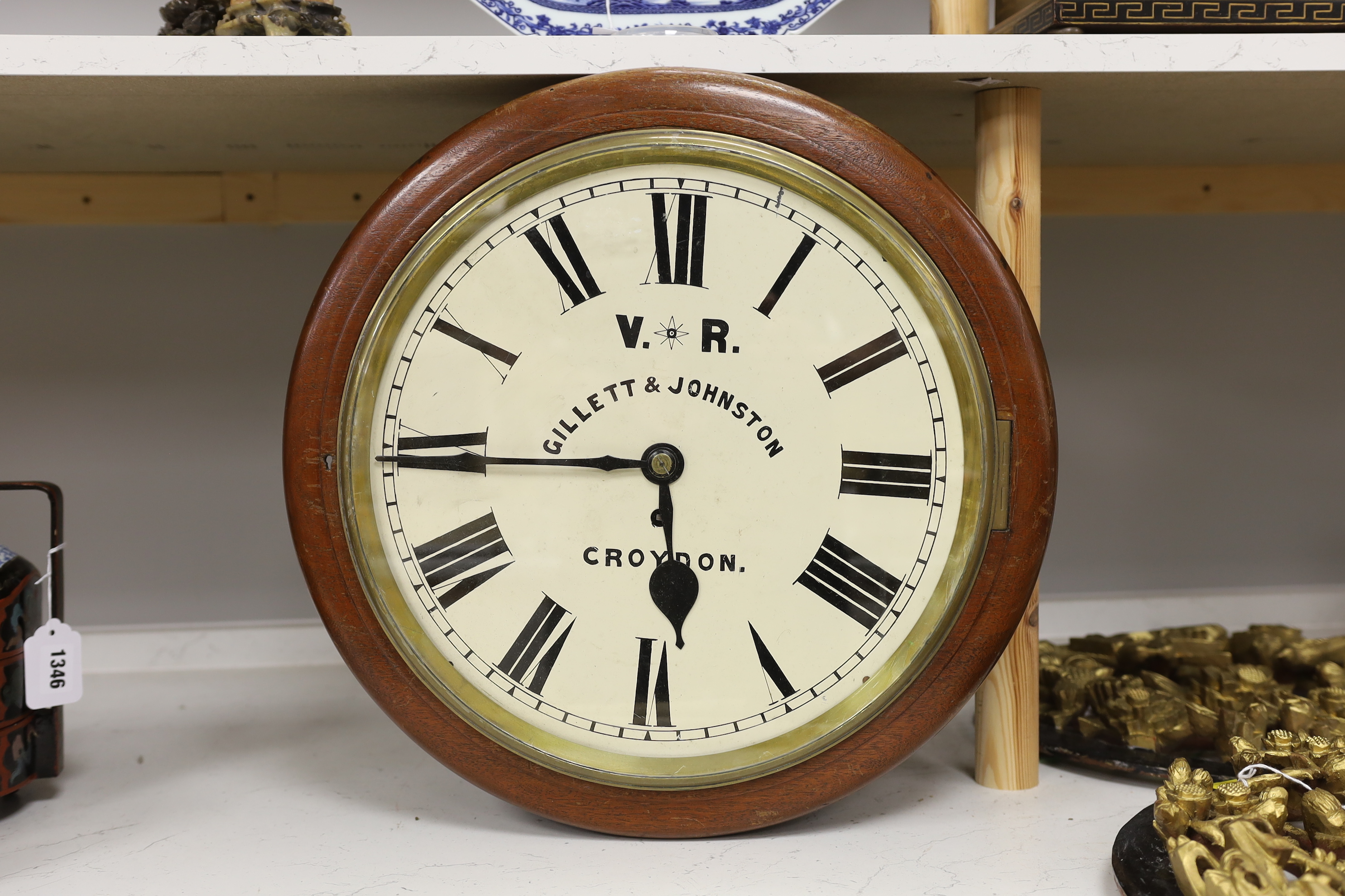 A Victorian double sided mahogany station / shop fusee timepiece, retailers name Gillett & Johnston, Croydon, 46cm diameter